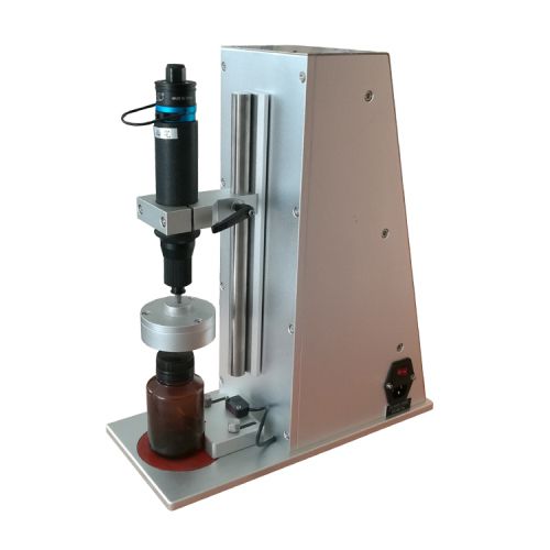 ماكينة تركيب أغطية العبوات الهوائية توضع على الطاولة SCM-100